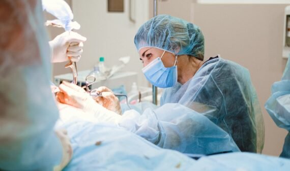 Woman Doing a Surgery on a Patient